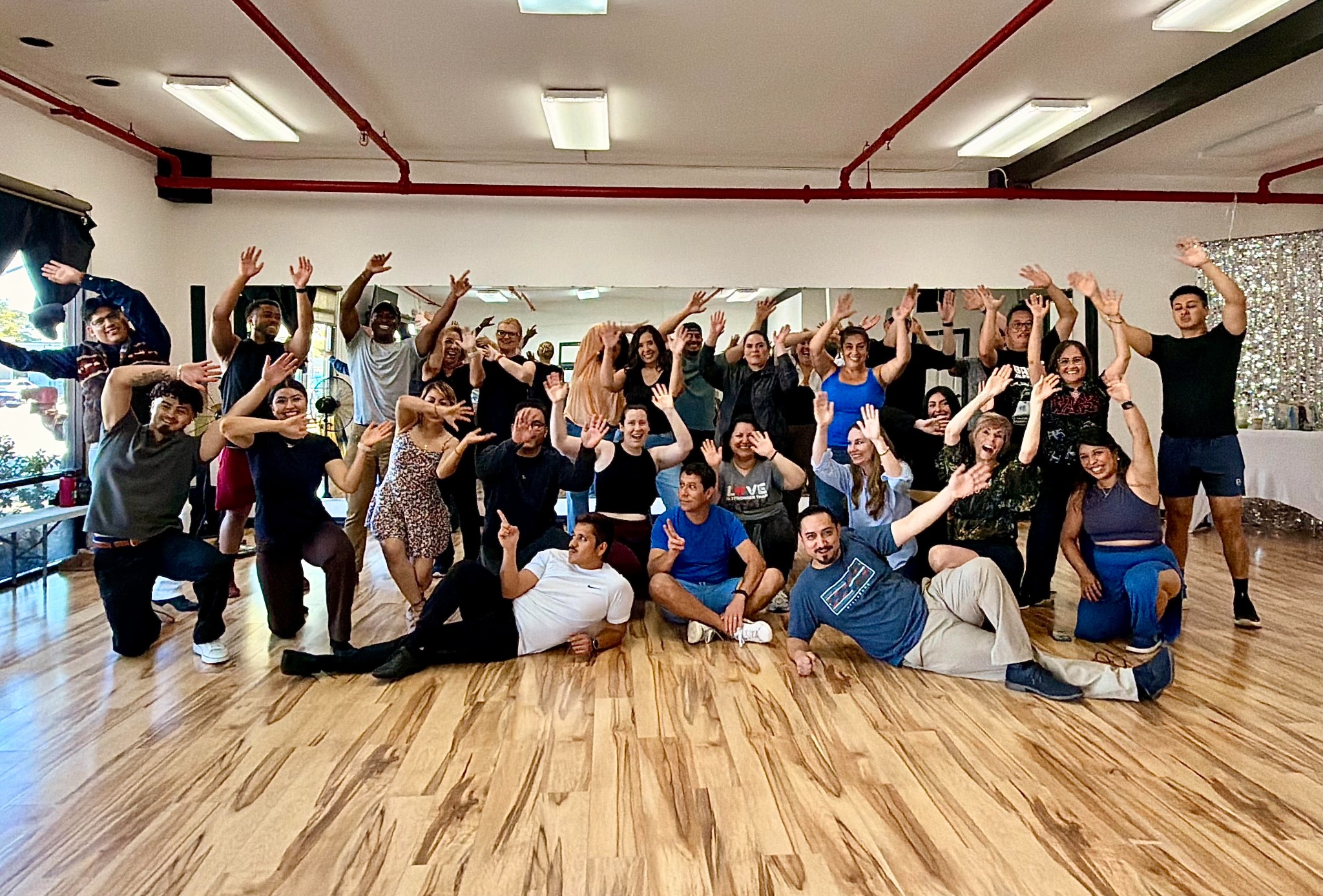 The Vida Dance Co. community celebrating together in the studio