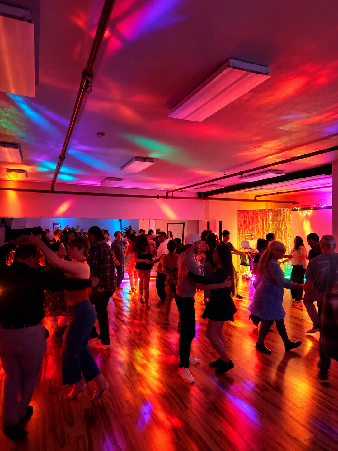 Vida dance social with colorful club lighting